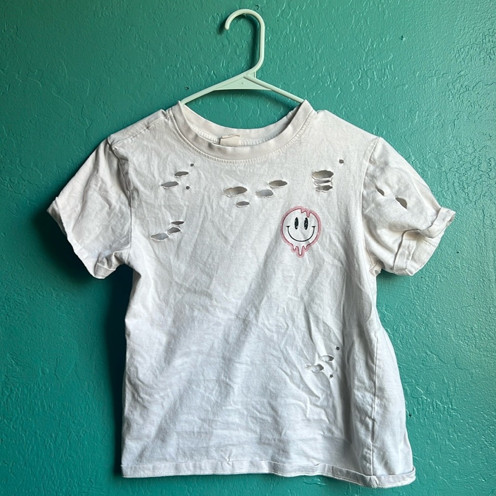 Ripped white T-shirt with pink happy face